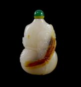 A Chinese white and russet jade snuff bottle, 19th century,carved in the form of a ribbon-tied