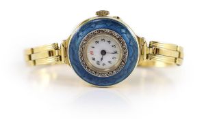 A lady's early to mid 20th century 18ct gold, enamel and diamond chip set manual wind wrist watch,