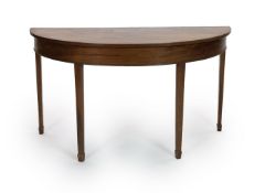 A George III mahogany D shaped table,on tapering square legs with spade feet, with plate glass