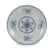 A Chinese carved blue and white dish, Yongzheng period,the centre painted with a flower medallion