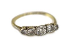 An early 20th century 18ct gold, platinum and graduated collet set five stone diamond ring,size N,