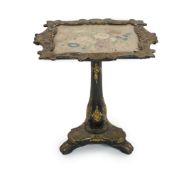 A Victorian papier mache pedestal table,with gilt foliate decoration on a black ground, the shaped