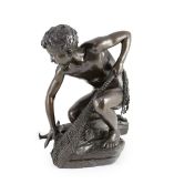 H. Gladenbeck and Son. A bronze figure of a boy catching a fish,on naturalistic rock base, signed