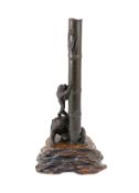 A Japanese bronze lamp, Meiji period,modelled as two monkeys clambering up a shaft of bamboo, on a