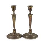 A pair of Sheffield plate candlesticks and nozzles,of neo-classical elliptical form, the stems