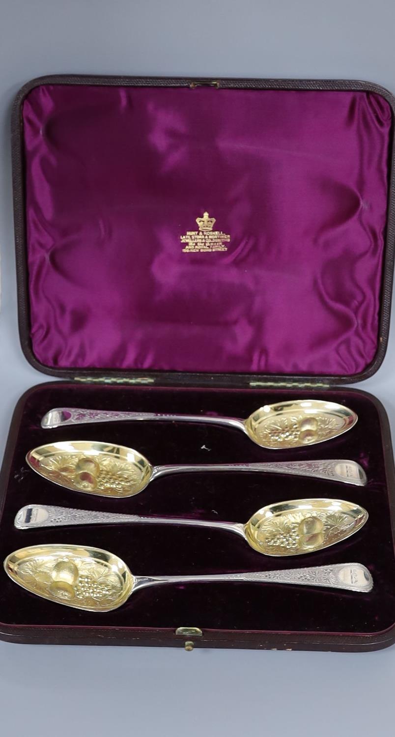 A cased matched set of four 19th century parcel gilt berry spoons, 7.5oz