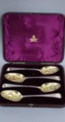 A cased matched set of four 19th century parcel gilt berry spoons, 7.5oz