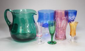 A mixed group of coloured glassware