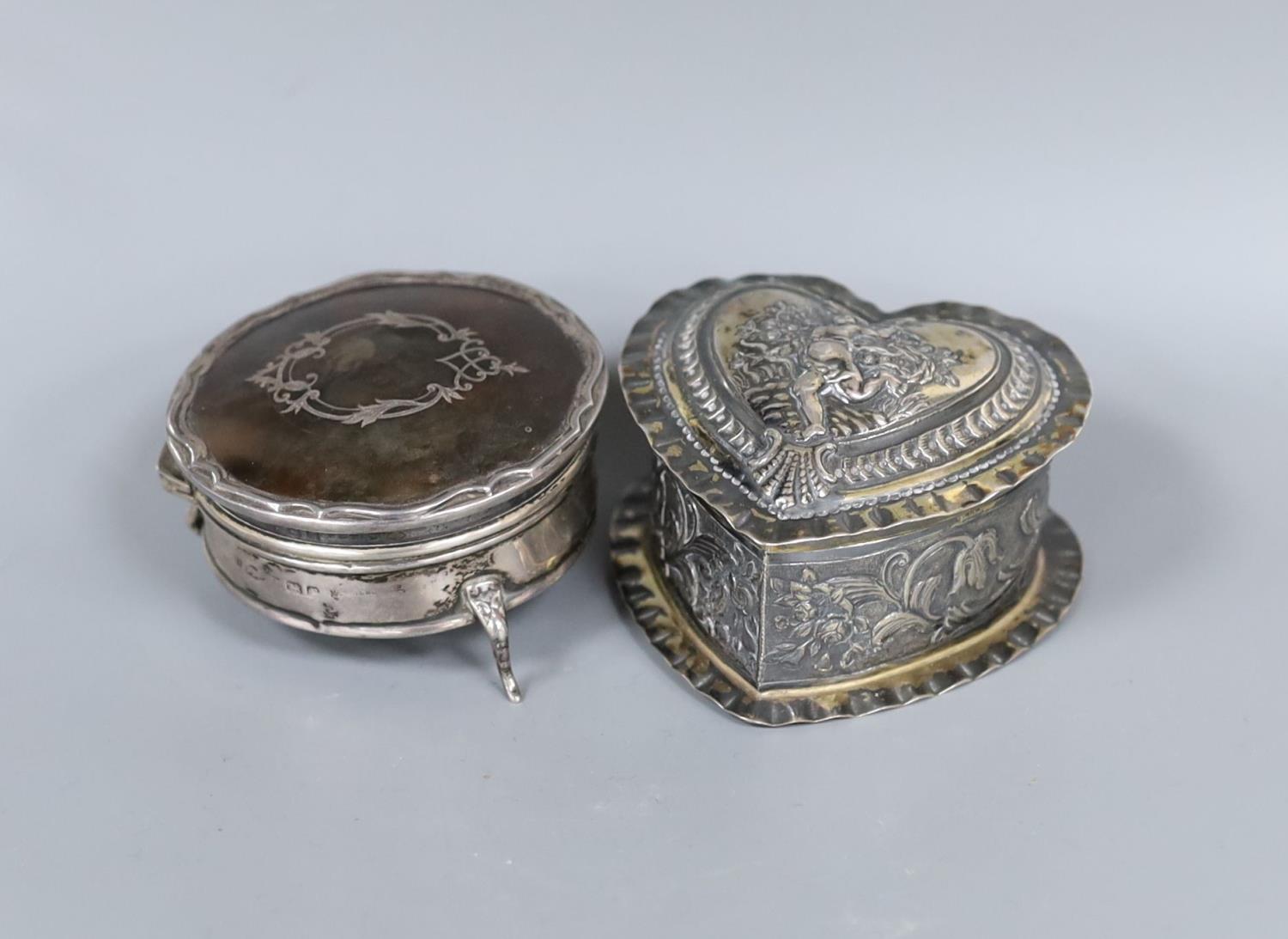 A George V silver and tortoiseshell pique circular trinket box, 71mm and a late Victorian embossed