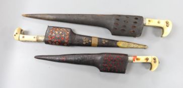 A group of three Indo-Persian daggers, longest blade 26cm, each within sheath