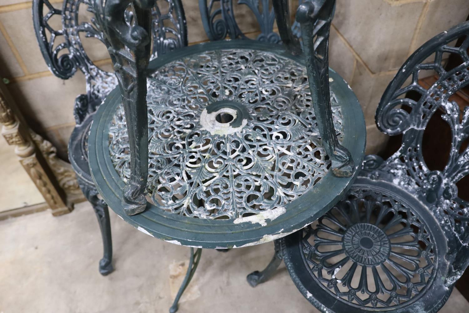 A Victorian style aluminium circular garden table, diameter 60cm, height 62cm and four chairs - Image 3 of 3