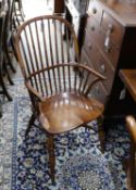A set of six reproduction ash and elm Windsor comb back armchairs with saddle seats and crinoline