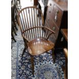 A set of six reproduction ash and elm Windsor comb back armchairs with saddle seats and crinoline