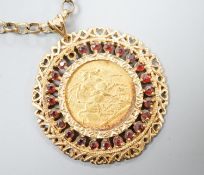 An 1892 gold sovereign, in a 9ct gold and garnet? set pendant mount on a 9ct gold chain, gross