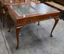 A reproduction George III style mahogany two drawer writing table, width 110cm, depth 72cm, height