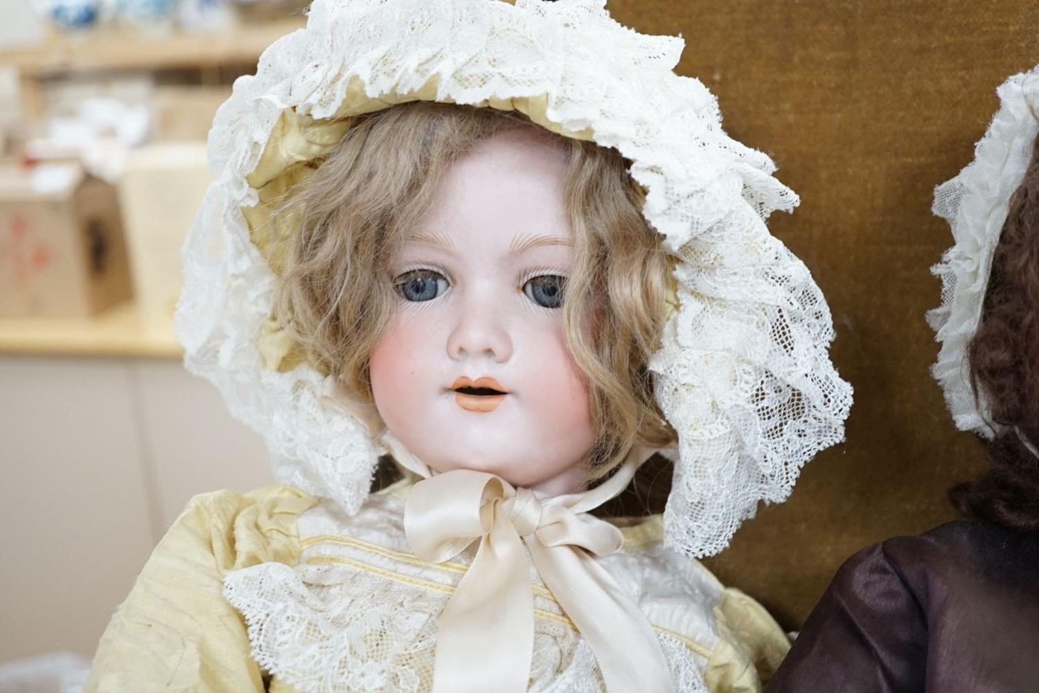 A Heubach, Koppelsdorf 250 bisque doll and an Armand Marseille 390 bisque doll, seated in turned - Image 4 of 5