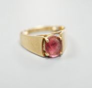 A 14k yellow metal and oval facet cut pink tourmaline? set ring, size P/Q.