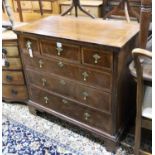 An early 18th century feather banded walnut chest of drawers, width 96cm, depth 53cm, height 92cm