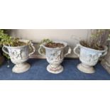 A set of three Victorian lead two handled garden planters, moulded with cherubs, diameter 38cm,