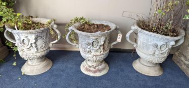 A set of three Victorian lead two handled garden planters, moulded with cherubs, diameter 38cm,