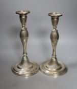 A pair of George III silver candlesticks, with waisted fluted stems, R.S. Sheffield, 1793 & 1796,