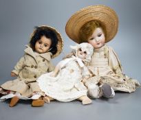 An Armande Marseille 1894 bisque doll, and two other bisque dolls