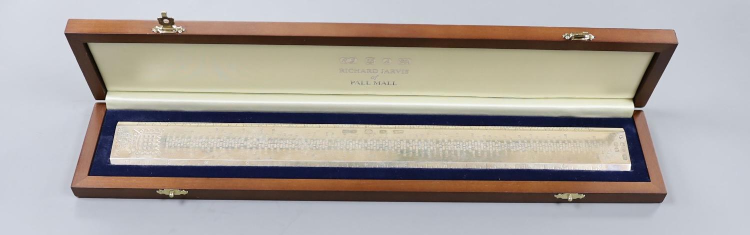 A cased modern silver 'Premier Rule' ruler, engraved with the names and dates of British Prime