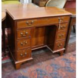 A reproduction George III style rosewood banded mahogany kneehole desk, length 88cm, depth 44cm,