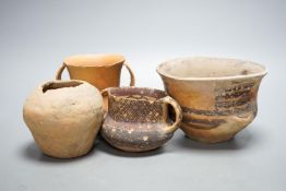 Four Chinese Neolithic pottery vessels, 11cm