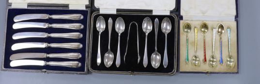 A cased set of six Danish gilt sterling and polychrome enamel coffee spoons, a cased set of six