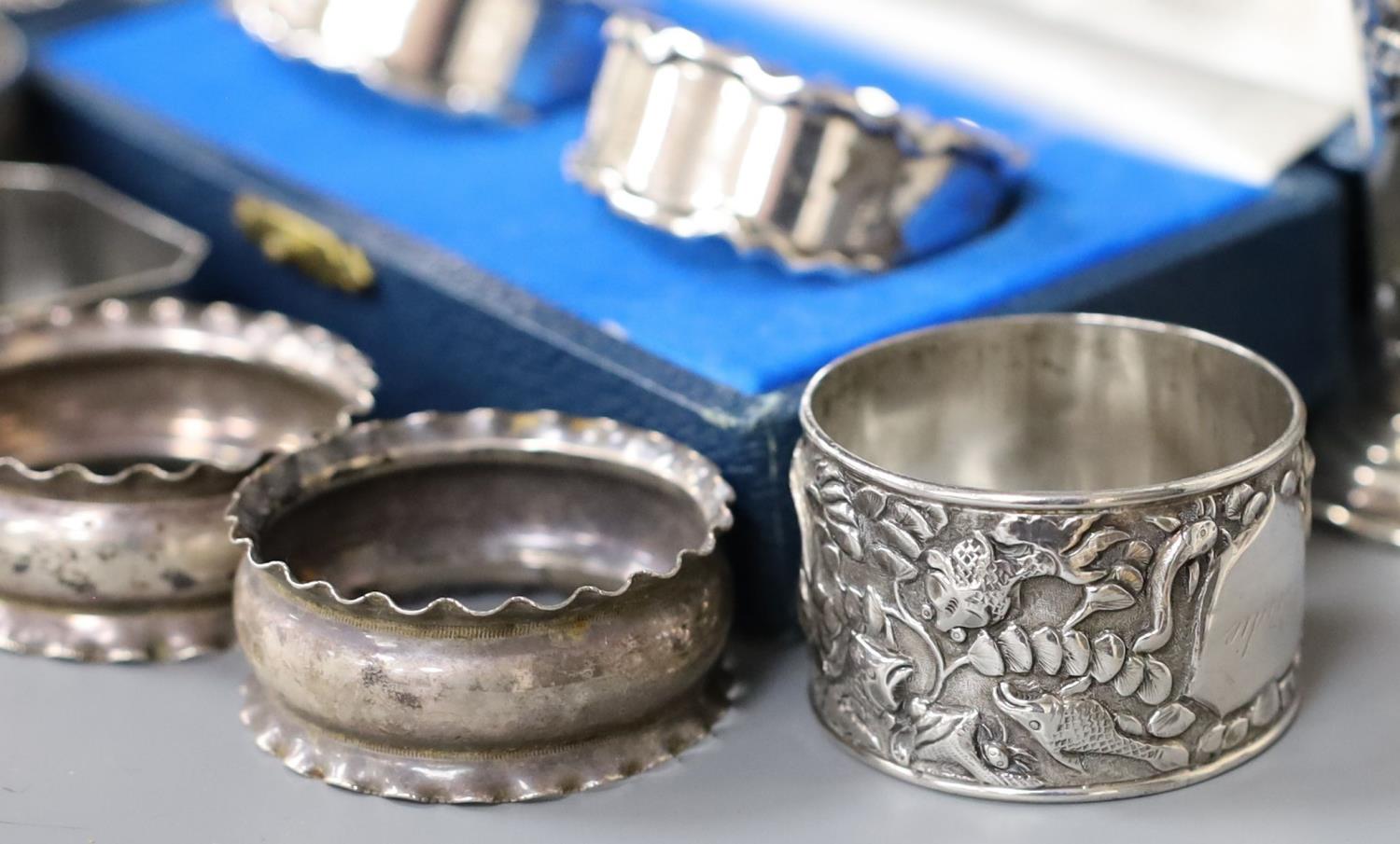 A cased pair of silver napkin rings, five others including one white metal and a two small silver - Image 4 of 4