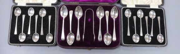Two cased sets of six silver coffee spoons, Birmingham and a cased set of six engraved silver