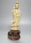 A soapstone Guanyin on base, 40cm