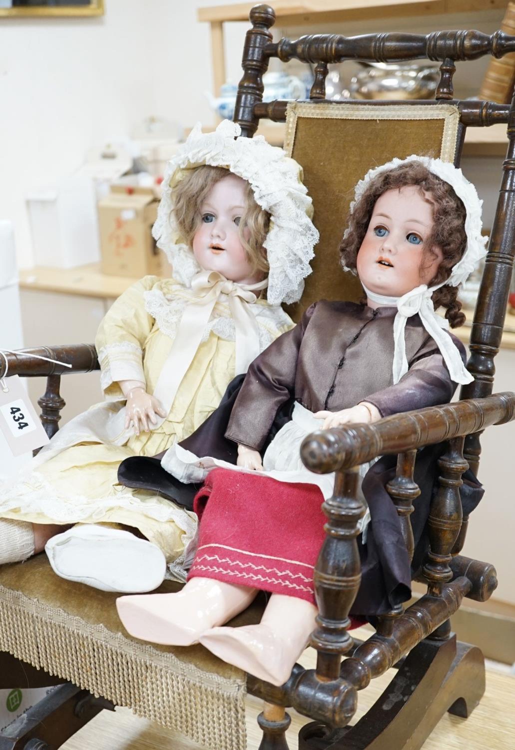 A Heubach, Koppelsdorf 250 bisque doll and an Armand Marseille 390 bisque doll, seated in turned