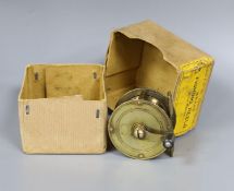 An Allcock brass fishing reel, 6cm. diam., in original box