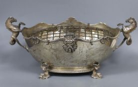 An ornate George V silver two handled oval rose bowl with sea horse handles and dolphin feet, Reid &