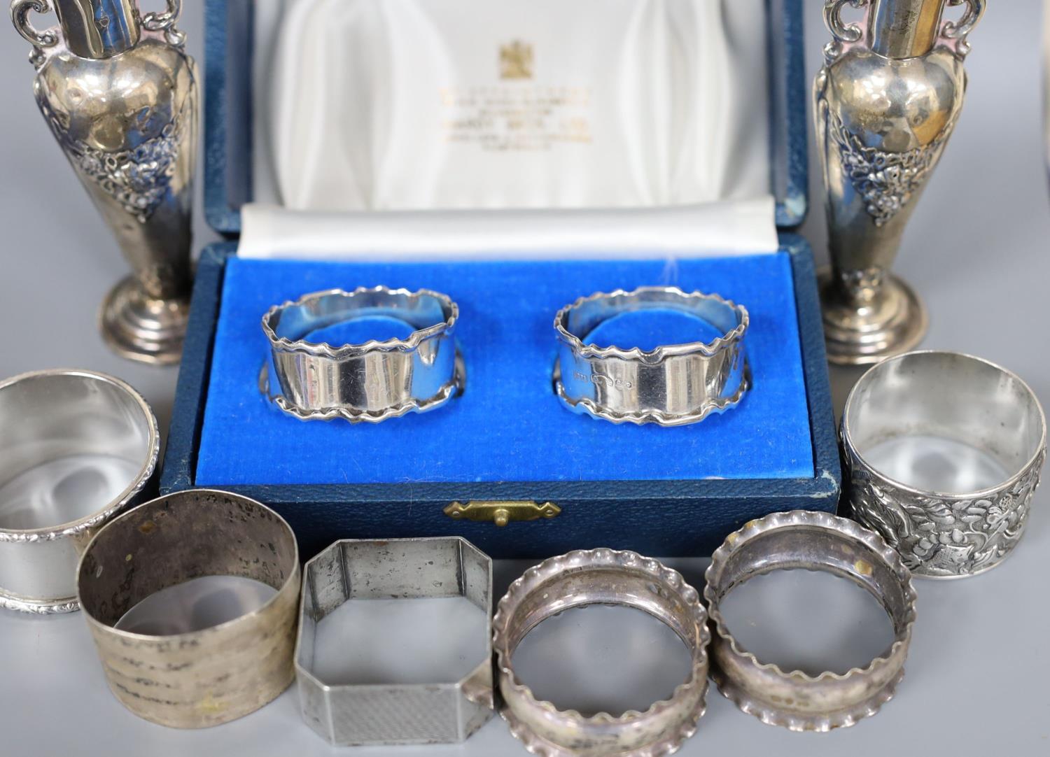 A cased pair of silver napkin rings, five others including one white metal and a two small silver - Image 3 of 4