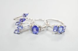 Three assorted modern 9ct white gold and tanzanite set dress rings, gross weight 8.6 grams.