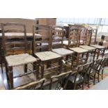 A set of six oak rush seat ladder back chairs