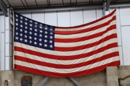 A large mid 20th century 'Stars and Stripes' American flag, approximately 460cm wide, height 240cm