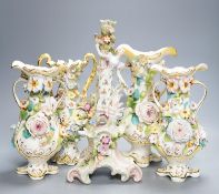 Four Coalport-type floral encrusted vases and a figural candlestick, 32cm