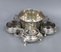 A silver sugar bowl, pair of silver bun salts and a silver mustard pot.
