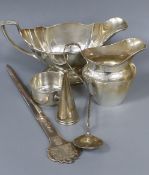 An American sterling sauceboat, a silver cream jug, a modern silver commemorative letter opener
