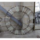 A decorative metal clock dial, diameter 122cm