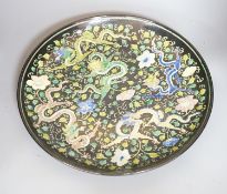 A large Chinese black ground 'dragon' dish, 43cm