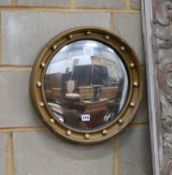 A Regency style circular gilt framed convex wall mirror, diameter 45cm