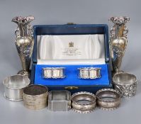 A cased pair of silver napkin rings, five others including one white metal and a two small silver