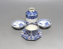 A Japanese blue and white vase, two similar dishes and a tea bowl and saucer