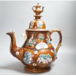 A large Measham bargeware teapot, 1886 (restored) 40cm