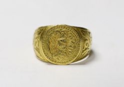 A late 16th/early 17th century yellow metal signet/seal ring, engraved with the initials SMU, the